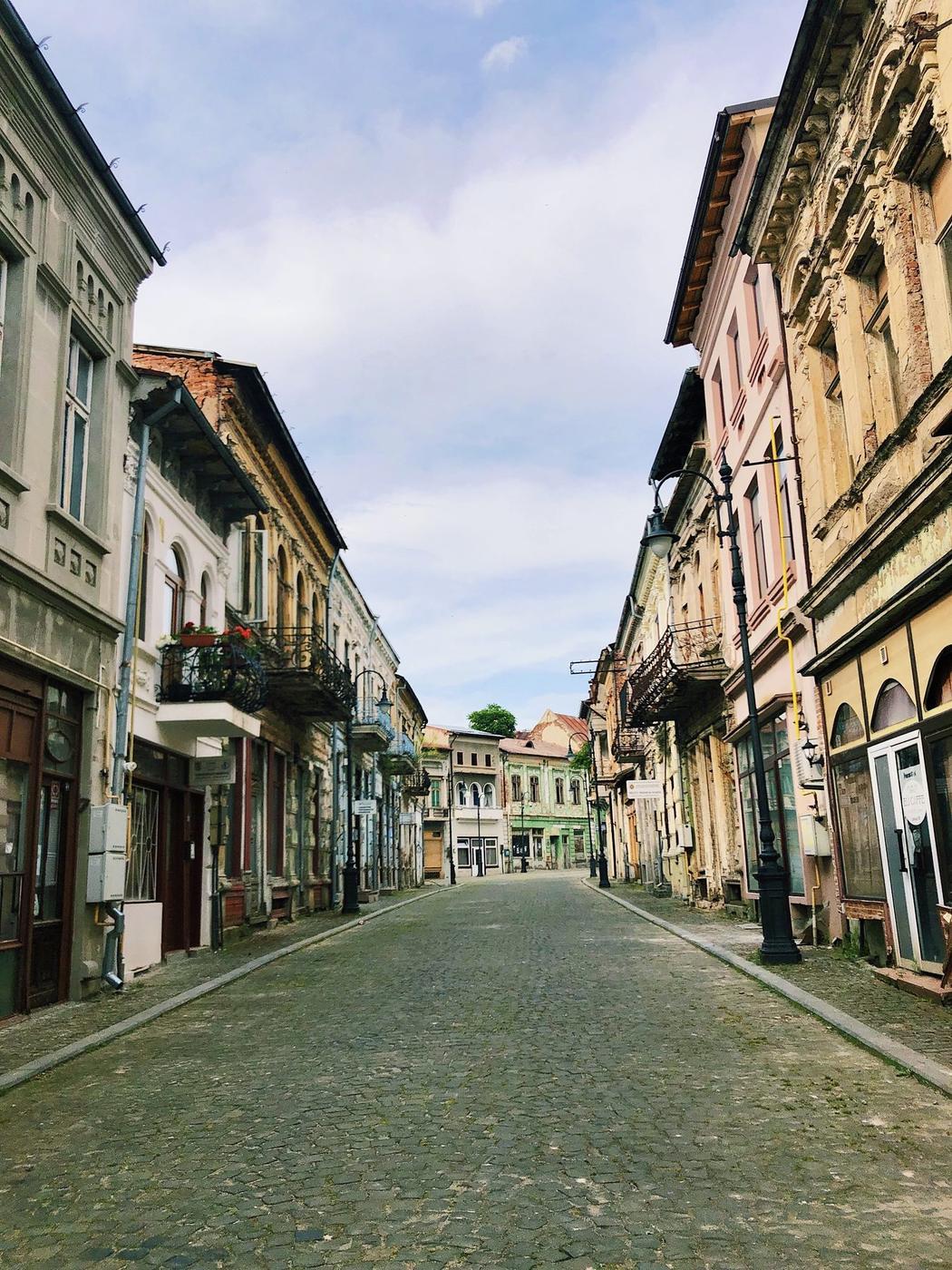 Cobblestone street lined with historic buildings