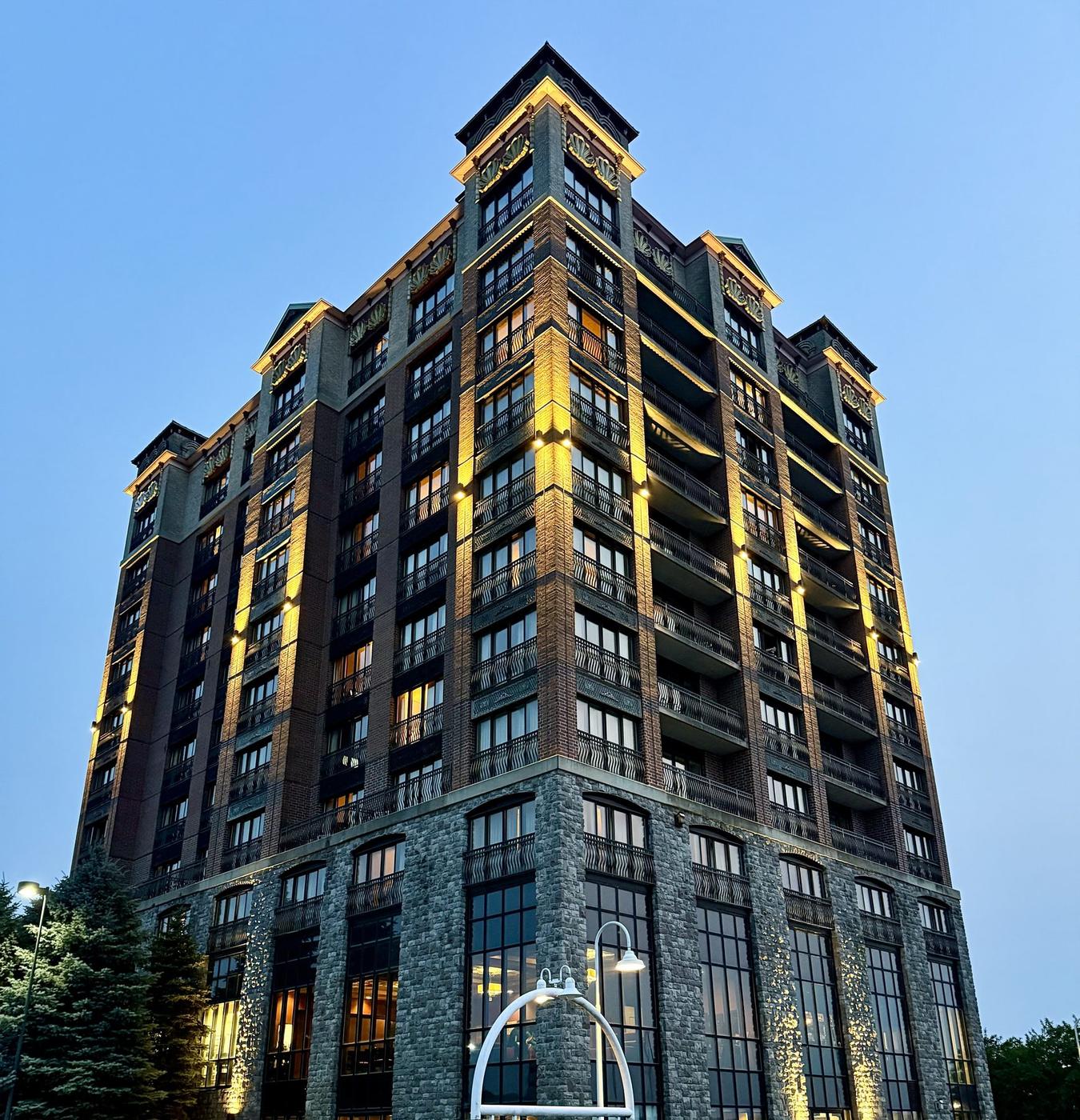 High-rise building lit up at dusk